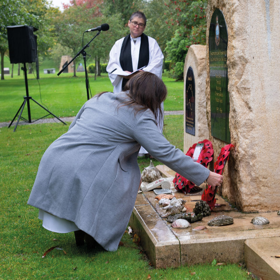 Tracey Morris lays a wreath on behalf of the NCCF